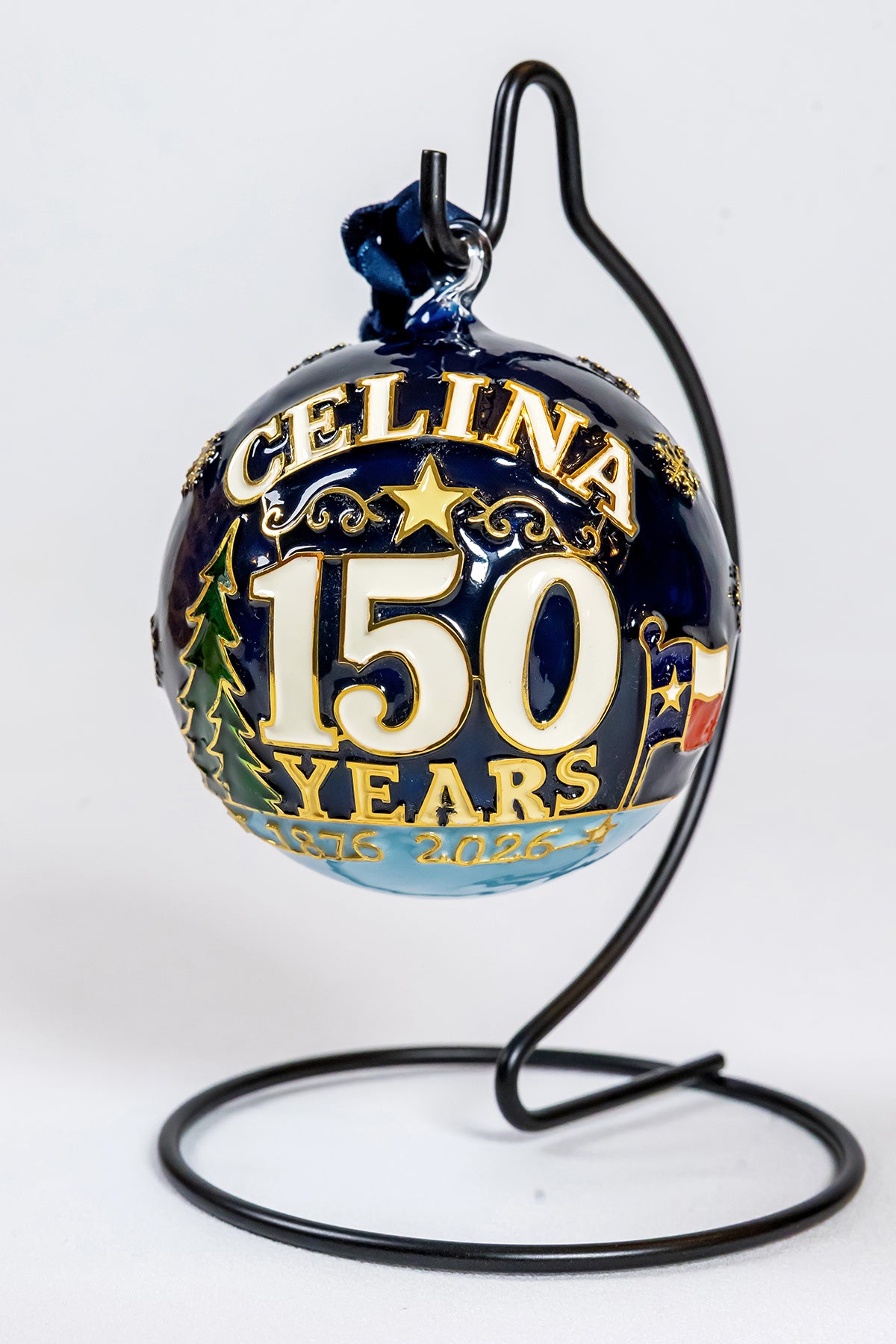 Front view of the Celina 150 Years hand-painted glass ornament showing the anniversary lettering, gold star, trees, Texas flag, and 1876 to 2026 ribbon.