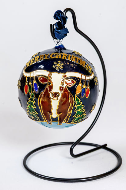 Reverse view of the Celina 150th anniversary ornament with a longhorn, Merry Christmas banner, colorful holiday lights, and evergreen trees.