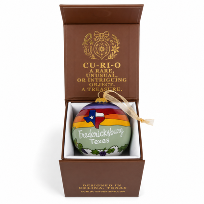 Fredericksburg Texas ornament presented inside an open CurioCity Designs keepsake gift box