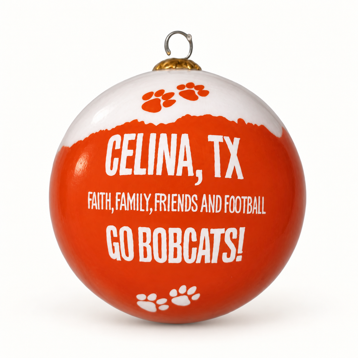 Celina Football Traditions orange and white glass ornament with paw prints and Faith, Family, Friends and Football lettering.