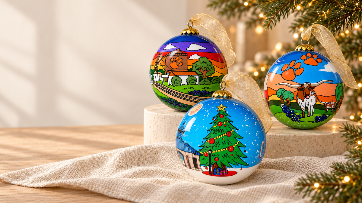 Three Celina glass ornaments in a warm Christmas setting, including Historical Downtown Celina, Celina Sunsets and Longhorn, and Downtown Celina Square Christmas Tree.