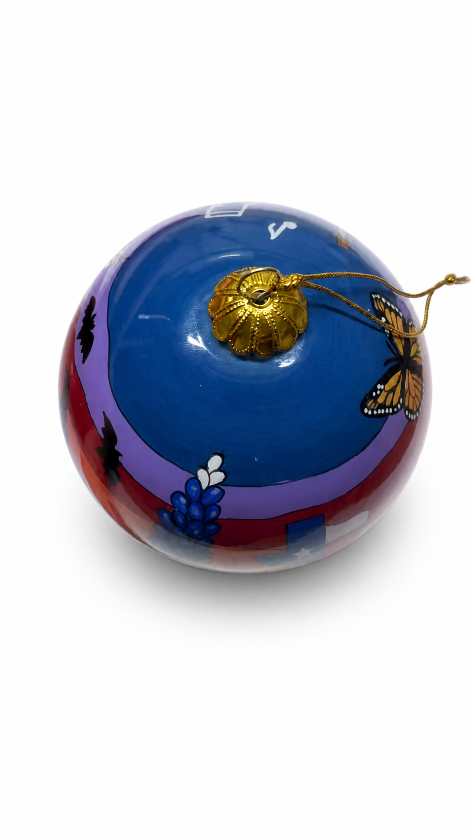Fredericksburg Texas hand-painted glass ornament isolated against a clean white studio background