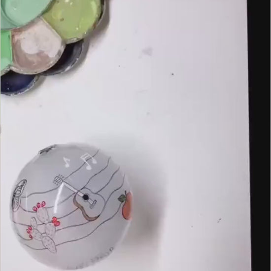 Behind-the-scenes video showing the Fredericksburg Texas ornament being reverse-painted by hand