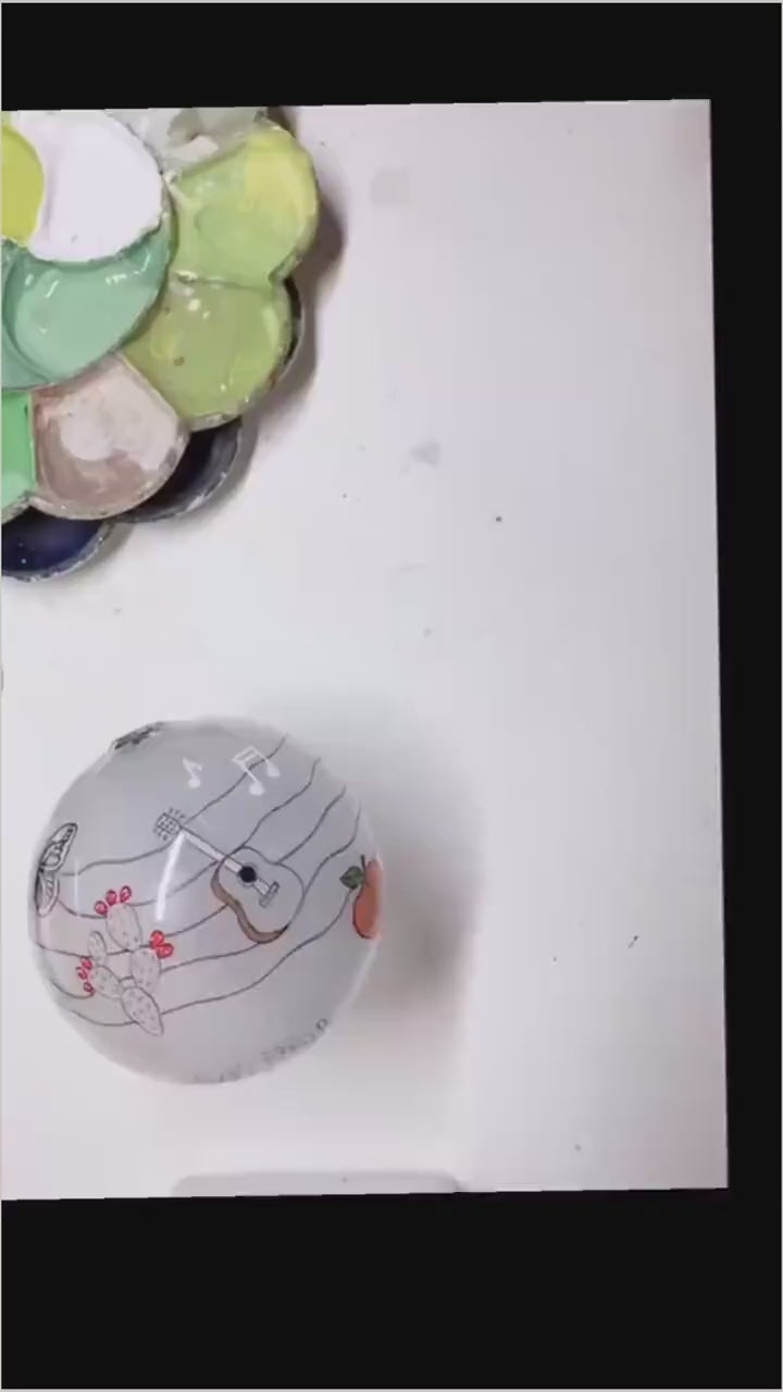 Behind-the-scenes video showing the Fredericksburg Texas ornament being reverse-painted by hand